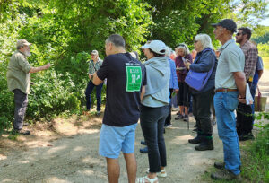 Mark Twery teaching a group of gardeners about invasives